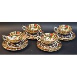 A set of four Royal Crown Derby Imari palette 1128 tea cups, saucers and tea plates, various dates,