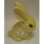 A Marmaduke rabbit in soft yellow tones