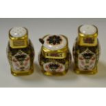 A Royal Crown Derby 1128 pattern condiment set comprising of salt and pepper pots,