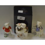 A Royal Crown Derby footballing teddy bear with blue and white stripes; another in red;