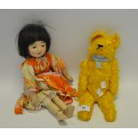 A mid-20th Century jointed teddy bear; a composite doll,