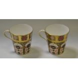A pair of Royal Crown Derby 1128 pattern coffee mugs