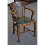 An early 20th century oak open arm chair, slat back, padded leather seat, tapering square legs, c.