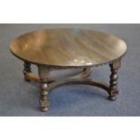 A Nigel Griffiths oak circular coffee table, turned legs, signed to leg. 43cm high x 99cm diameter.