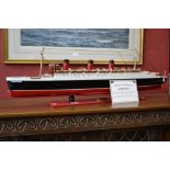 Handcrafted model of the Queen Mary with certificate of authenticity detailing specifications,