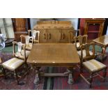 A mid 20th century oak dining room suite, comprising draw-leaf dining table,