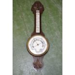 An oak banjo barometer.