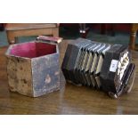 A 21 key squeeze box accordion, fretwoeked ends.