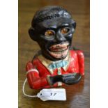 A Blackamoor cast iron money bank