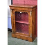 A Victorian walnut pier cabinet, frieze inlaid with satinwood swags,