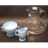 A Victorian pressed glass cream jug and sugar bowl;