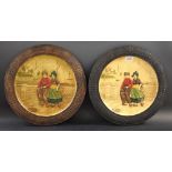 A pair of Bretby Dutch boy and girl chargers,