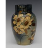 An Art Pottery ovoid vase, decorated impasto with hellebores,