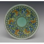 A Crown Ducal Charlotte Rhead plate, tube lined with stylised flowers and foliage, in yellow,