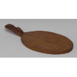 Robert Thompson, Mouseman of Kilburn, an oval paddle shaped cheese board,