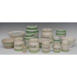 A set of three graduated Art Deco British Anchor Cottage Green pattern cylindrical storage jars,