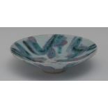 Vivienne Foley - an Art Pottery circular shallow dish, decorated in lilac and turquoise, 15.