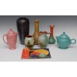 Studio Pottery - a Fiesta teapot and cover, in green, 21cm high; a similar hotwater jug, in pink,