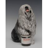 A Beswick Dulux advertising Old English Sheepdog, with paw on paint can, black,