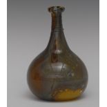 A hand blown Studio glass bottle vase, ribbed neck, in swirls of grey and ochre, 17.
