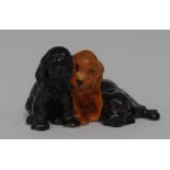 A Royal Worcester animal model, by Doris Lindner, of three spaniel puppies,