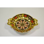 A Royal Crown Derby 1128 pattern two handled pedestal shaped circular trinket dish,