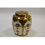 A Royal Crown Derby 1128 pattern ginger jar and cover, all gold border, 12cm high,