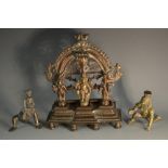 An Indian domestic shrine, cast with three deities upon an alter,