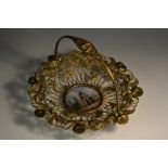 A Victorian gilt metal swing handled basket,