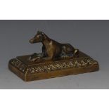 A post-Regency bronze desk weight, as a recumbent hound, rectangular base with acanthus border, 10.