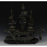 A large Chinese green jade model, of a three-mast junk, the bow,
