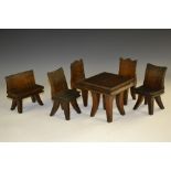 Folk Art - an early 20th century oak suite of miniature furniture, comprising four chairs,