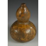 A large Colonial gourd flask, engraved with European figures in a scene of classical antiquity,