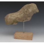 A 16th century limestone fragment, carved as a lion, 33cm long, c.
