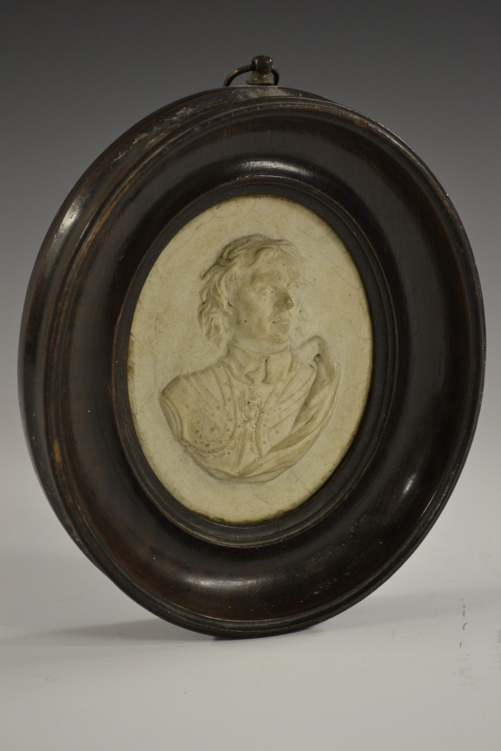 A 19th century Tassie type composition oval portrait plaque, in relief with Oliver Cromwell,