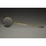 An Edwardian silver combination magnifying glass and propelling pencil, 21cm long, retailed by A.W.