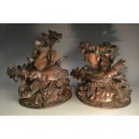 A pair of late 19th century Black Forest mantel models, carved with song birds and foliage,