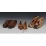 A pair of Inuit boots, 29cm long; a pair South Atlantic hide shoes, 27cm long,