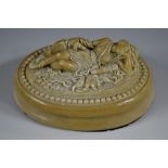 A 19th century composition desk model, of Diana the Huntress, sleeping, a hound beside her,