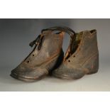 A pair of Victorian children's black 'pebble' leather lace-up boots, brown leather soles, 11.