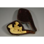 A 19th century faux Meerschaum novelty pipe, modelled as a young girl with a basket of flowers,