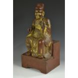 A Chinese lacquer and parcel gilt figure, of an immortal seated, 43cm high,