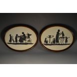 A pair of early 20th century painted silhouettes, depicting scenes of family life, oval, 14.