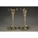 A near pair of Indian silver coloured metal flared trumpet vases,