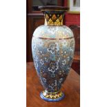 A Doulton Lambeth Chine Ware ovoid vase, applied with flowers and foliage on a shagreen ground,