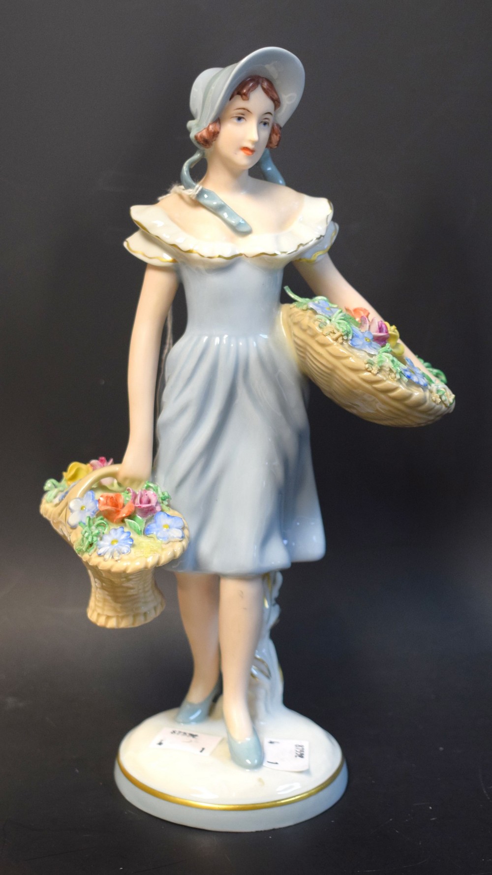 A Royal Dux figure, of a flower seller, no.