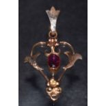 An Art Nouveau open heart pendant, set with a central oval pale purple amethyst,