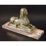 A silver coloured metal model of a Sphynx, maker's name Andres in the maquette, marble base,