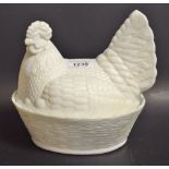 An early 20th century opaline glass hen egg box and cover
