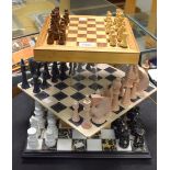 A soapstone chess set with board; a marble chess set with board;